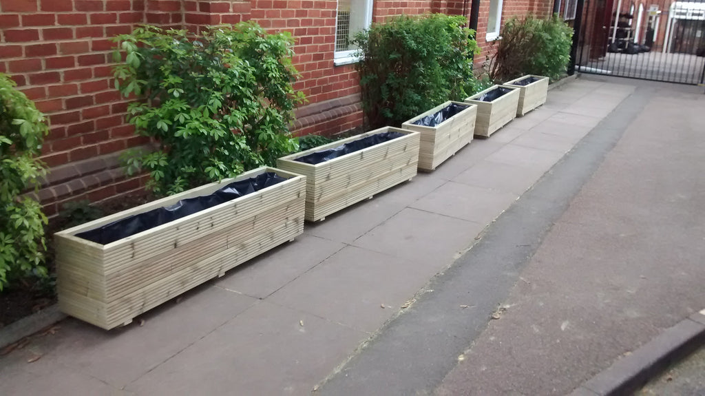 3 rows of decking trough wooden planters