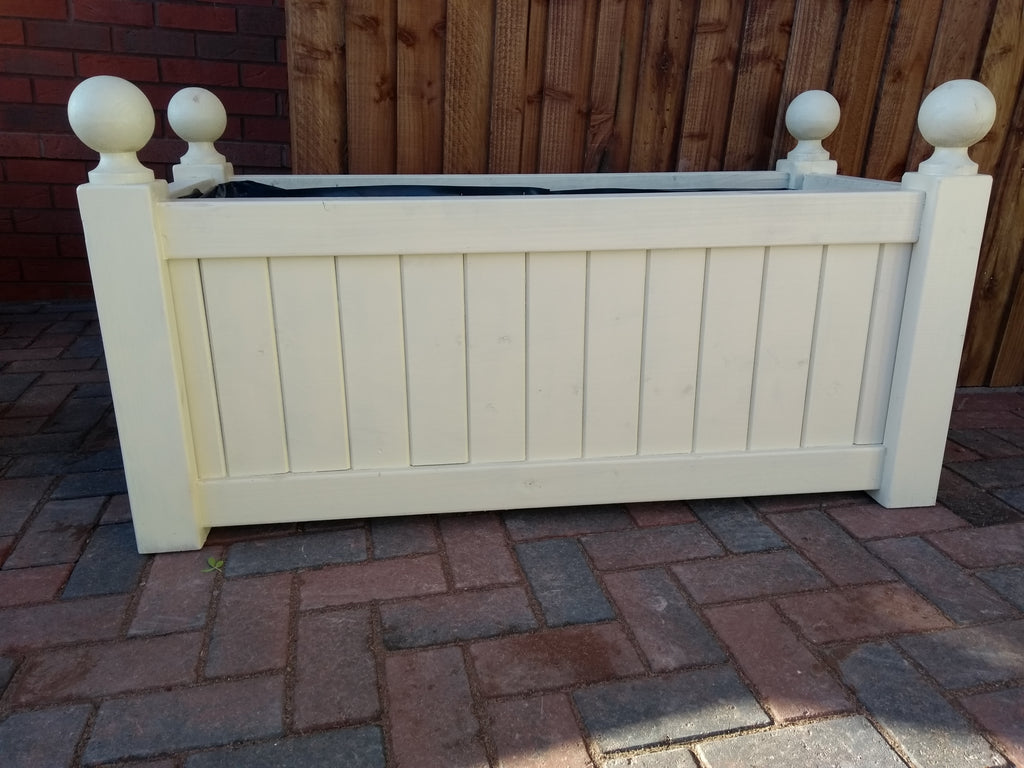 Versailles trough planters painted with Cuprinol's Country Cream