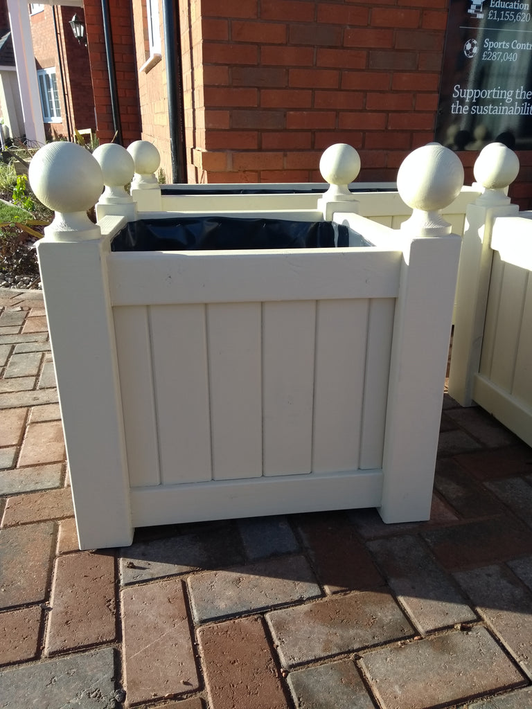 Versailles square wooden planters painted with Cuprinol's Country Cream