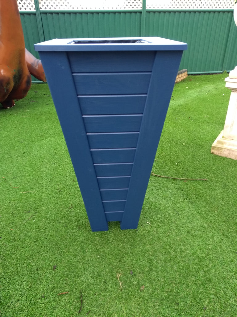 Tapered Aston planters painted in Cuprinol's Iris