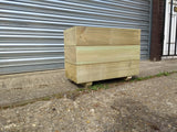 Smooth trough wooden planters with 3 rows of planks