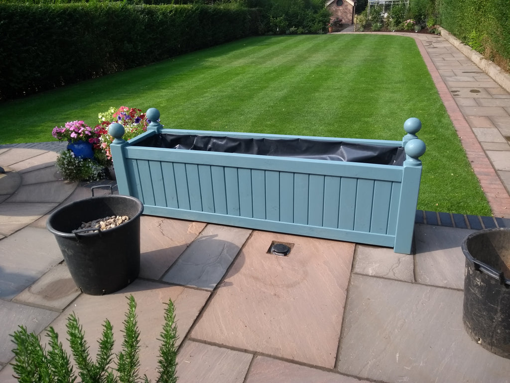 Versailles trough planters painted with Cuprinol's Beaumont Blue