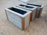 Reclaimed timber style wooden planters with rusted metal corners