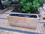 Smooth trough wooden planters with 4 rows of planks