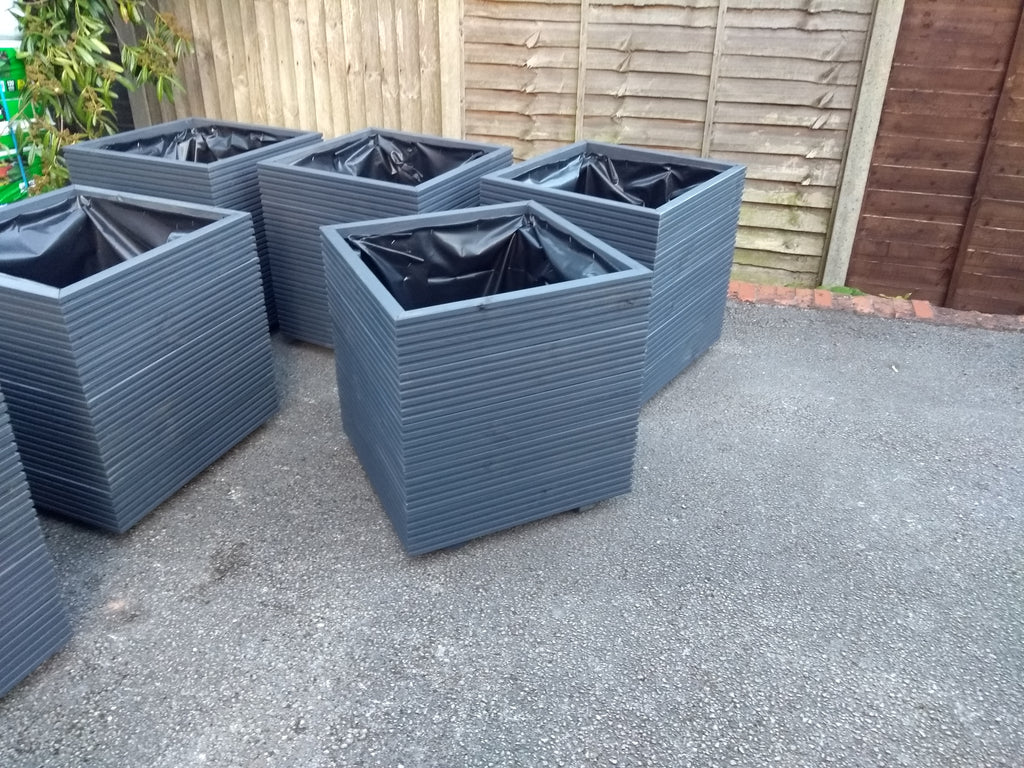 Square wooden planters, 5 rows of decking, painted in Cuprinol's Urban Slate