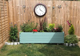 Block style trough wooden planters painted in Cuprinol's Seagrass