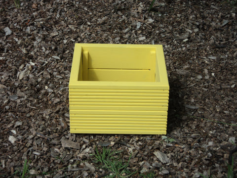 Yellow 40cm square planter made from 2 rows of treated decking