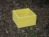 Yellow 40cm square planter made from 2 rows of treated decking