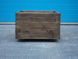 Square wooden planters, 3 rows of decking, stained medium oak