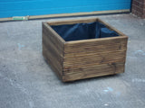 Square wooden planters, 3 rows of decking, stained medium oak