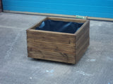 Square wooden planters, 3 rows of decking, stained medium oak