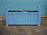 Versailles trough planters painted with Cuprinol's Forget-Me-Not