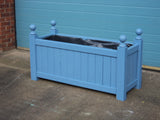 Versailles trough planters painted with Cuprinol's Forget-Me-Not