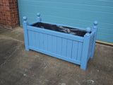 Versailles trough planters painted with Cuprinol's Forget-Me-Not
