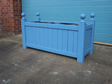 Versailles trough planters painted with Cuprinol's Forget-Me-Not