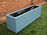 3 rows of decking trough wooden planters painted in Cuprinol Forget Me Not