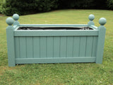 Versailles trough planters painted with Cuprinol's Beaumont Blue