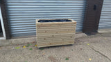 Block style trough wooden planters (tall) with spaces between the rows