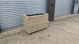 Block style trough wooden planters (tall) with spaces between the rows
