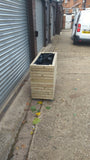 Block style trough wooden planters (tall) with spaces between the rows