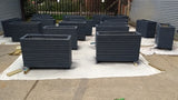 Block style trough wooden planters with spaces between the rows painted with Cuprinol's Urban Slate