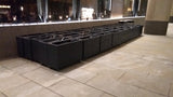 Block style trough wooden planters with spaces between the rows painted with Cuprinol's Urban Slate