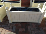Versailles trough planters painted with Cuprinol's Country Cream