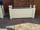 Versailles trough planters painted with Cuprinol's Country Cream