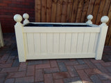 Versailles trough planters painted with Cuprinol's Country Cream