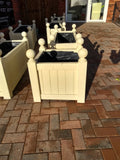 Versailles square wooden planters painted with Cuprinol's Country Cream