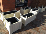 Versailles square wooden planters painted with Cuprinol's Country Cream
