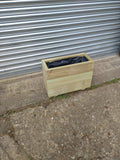 Smooth trough wooden planters with 3 rows of planks