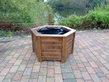 Aston hexagonal wooden planters - stained with warm oak woodstain