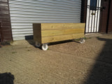 Smooth trough planters with 3 rows of planks on wheels / casters