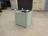 Versailles square wooden planters painted with Farrow and Ball's Vert de Terre