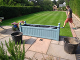 Versailles trough planters painted with Cuprinol's Beaumont Blue