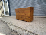 5 rows of decking large trough wooden planters stained with a Light Oak finish