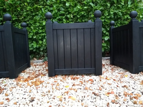 Versailles square wooden planters painted with Cuprinol's Black Ash