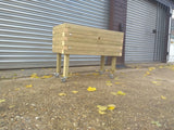 Block style raised wooden planters on casters / wheels and varnished