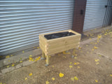 Block style raised wooden planters on casters / wheels and varnished