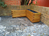 L shaped block style corner wooden planters with a Light Oak stain