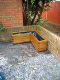L shaped block style corner wooden planters with a Light Oak stain