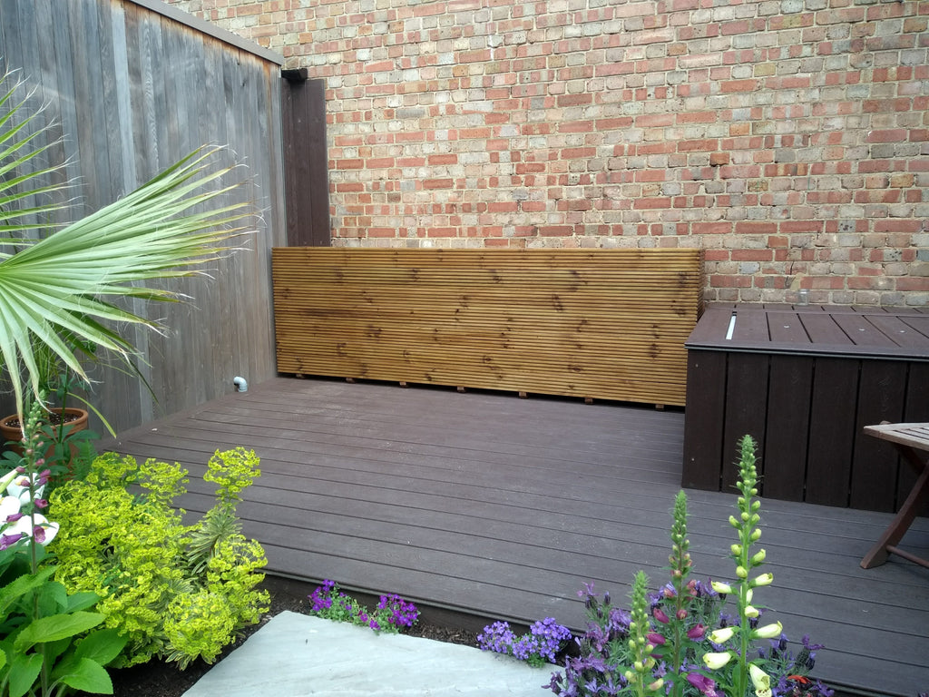 7 rows of decking large trough wooden planters stained with a Warm Oak finish