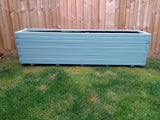 Block style trough wooden planters painted in Cuprinol's Seagrass