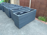 5 rows of decking large trough wooden planters painted in Cuprinol's Urban Slate
