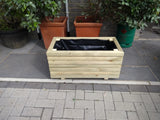 Block style trough wooden planters (short) with spaces between the rows