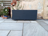 4 rows of decking large trough wooden planters painted in Cuprinol's Urban Slate