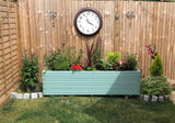 Block style trough wooden planters painted in Cuprinol's Seagrass